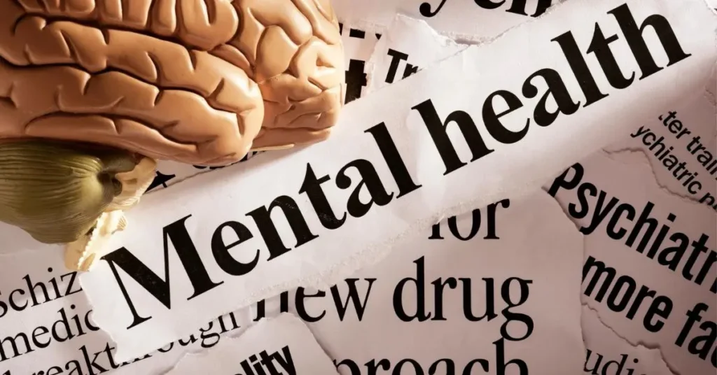 मानसिक स्वास्थ्य से जुड़ी तस्वीर जिसमें दिमाग का मॉडल और “Mental Health” लिखा हुआ है